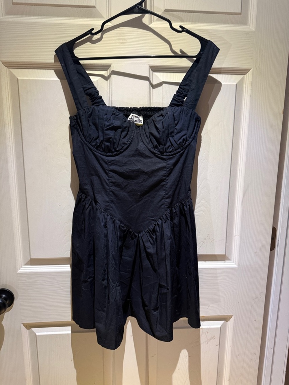 Fitted Black Sleeveless Mini Dress with Structured Bust